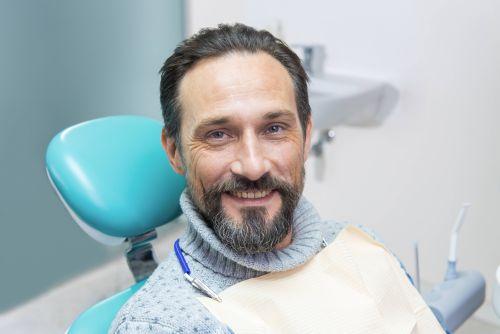 An image of a man smiling after getting a root canal in Wahroonga, NWS