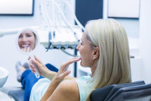 An image of a woman smiling after getting a dentures in Wahroonga, NWS