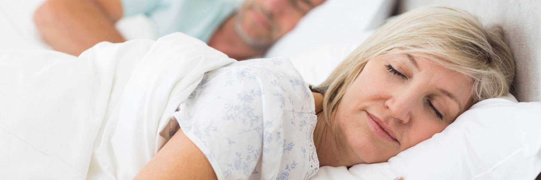 An image of a couple sleeping peacefully after a sleep apnoea treatment in Wahroonga, NWS